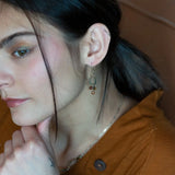 Tiny brass hammered drop earrings with brown crystal, pyrite, and carved hessonite gemstone dangles