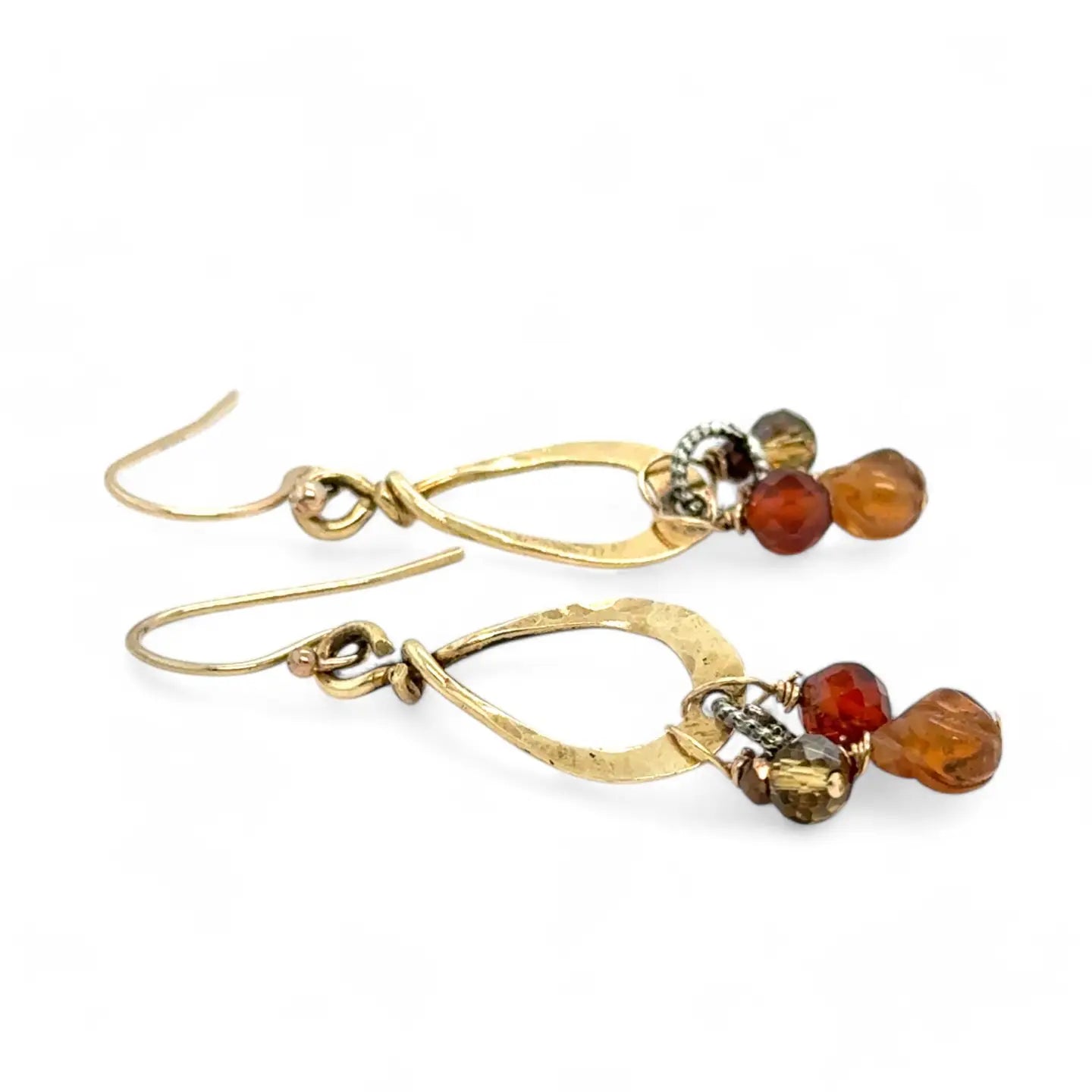 Tiny brass hammered drop earrings with brown crystal, pyrite, and carved hessonite gemstone dangles
