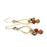 Tiny brass hammered drop earrings with brown crystal, pyrite, and carved hessonite gemstone dangles