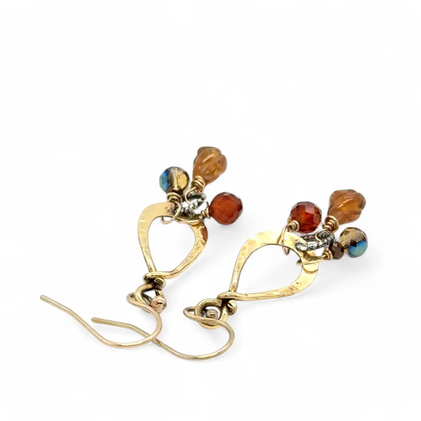 Tiny brass hammered drop earrings with brown crystal, pyrite, and carved hessonite gemstone dangles
