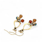 Tiny brass hammered drop earrings with brown crystal, pyrite, and carved hessonite gemstone dangles