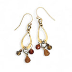 Tiny brass hammered drop earrings with brown crystal, pyrite, and carved hessonite gemstone dangles