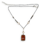 hessonite garnet faceted rectangle in oxidized sterling silver box on a chain made of gold filled squares, oxidized handmade hammered twisted bars and chain necklace