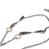 hessonite garnet faceted rectangle in oxidized sterling silver box on a chain made of gold filled squares, oxidized handmade hammered twisted bars and chain necklace