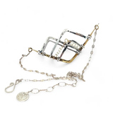 Brass and oxidized stamped sterling silver points to create a mountain scape adorned with fresh water pearl wrapped in gold filled wire on a dainty sterling silver chain necklace