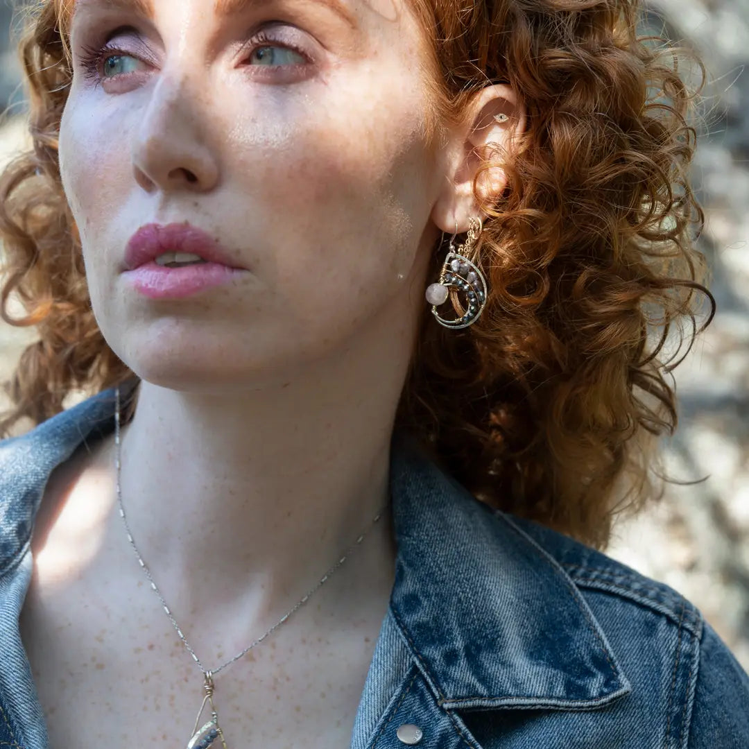 Amethyst, purple fresh water pearl, and pyrite gemstones embellish a sterling silver small earrings with gold filled wire