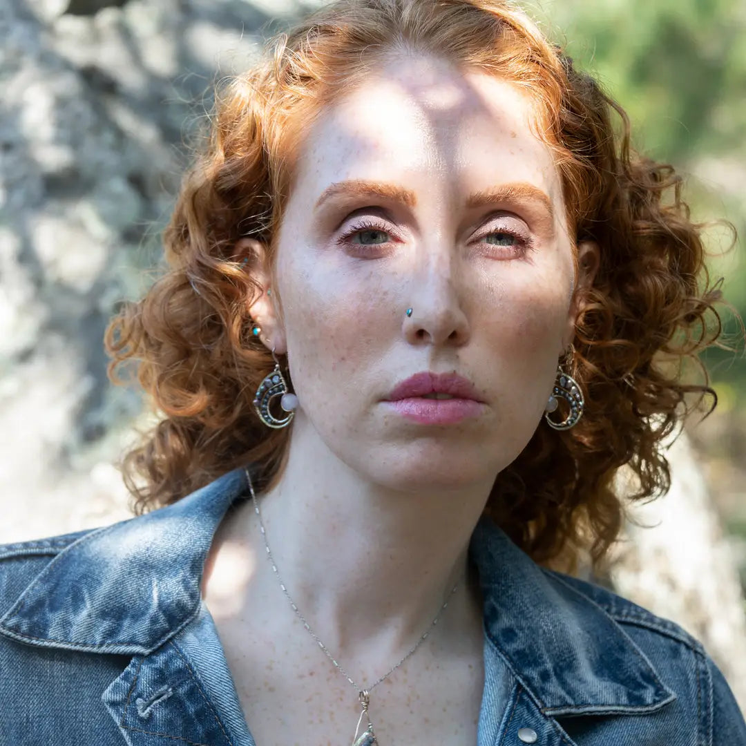 Amethyst, purple fresh water pearl, and pyrite gemstones embellish a sterling silver small earrings with gold filled wire