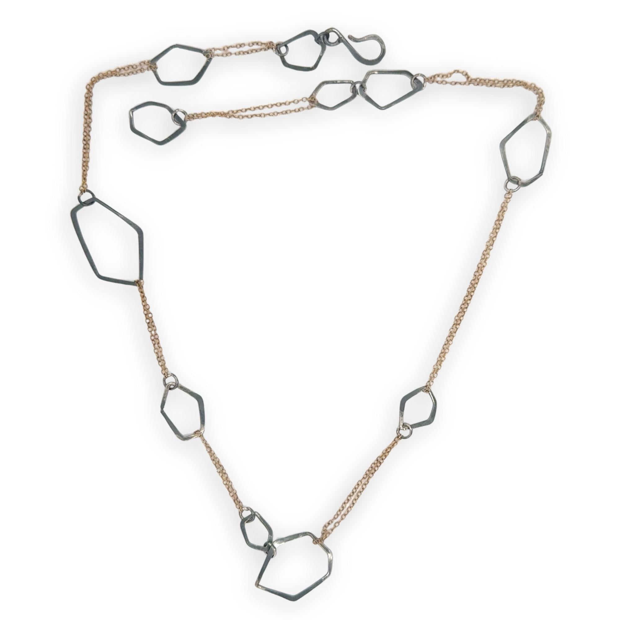 darkened sterling silver hammered geometric shapes held within gold filled delicate doubled up chain necklace