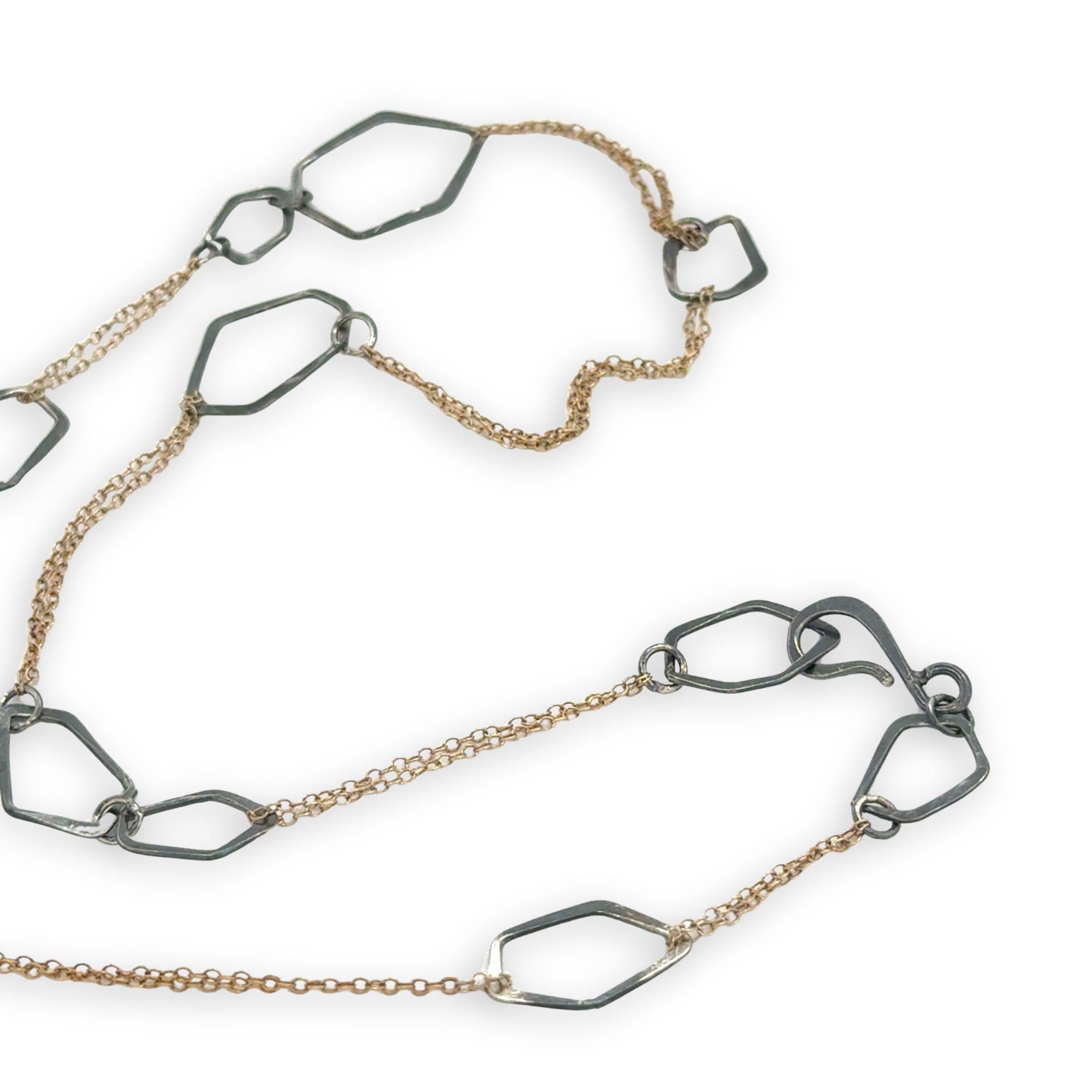 darkened sterling silver hammered geometric shapes held within gold filled delicate doubled up chain necklace