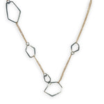 darkened sterling silver hammered geometric shapes held within gold filled delicate doubled up chain necklace