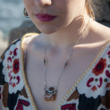 Orange rough cut quartz slab gemstone held within sterling silver and gold-filled pendant necklace. Smokey quartz and oxidized sterling silver twist accent. Pyrite built into sterling silver chain