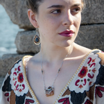 Orange rough cut quartz slab gemstone held within sterling silver and gold-filled pendant necklace. Smokey quartz and oxidized sterling silver twist accent. Pyrite built into sterling silver chain