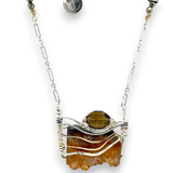 Orange rough cut quartz slab gemstone held within sterling silver and gold-filled pendant necklace. Smokey quartz and oxidized sterling silver twist accent. Pyrite built into sterling silver chain