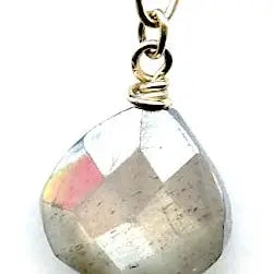 Faceted moonstone drops hang from a mini bronze hot air balloon shaped earring with blue crystal and pyrite gemstones