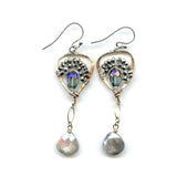 Faceted moonstone drops hang from a mini bronze hot air balloon shaped earring with blue crystal and pyrite gemstones