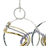 Sterling silver handmade hoop with lavender cubic zirconia stones weaved within brass and oxidized sterling silver twisted wire