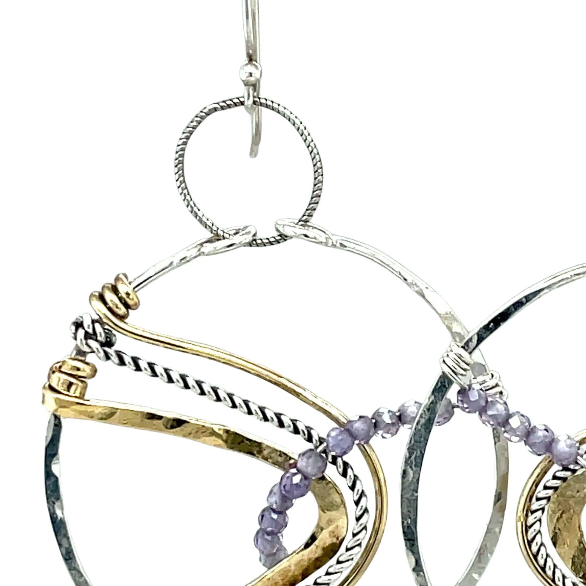 Sterling silver handmade hoop with lavender cubic zirconia stones weaved within brass and oxidized sterling silver twisted wire