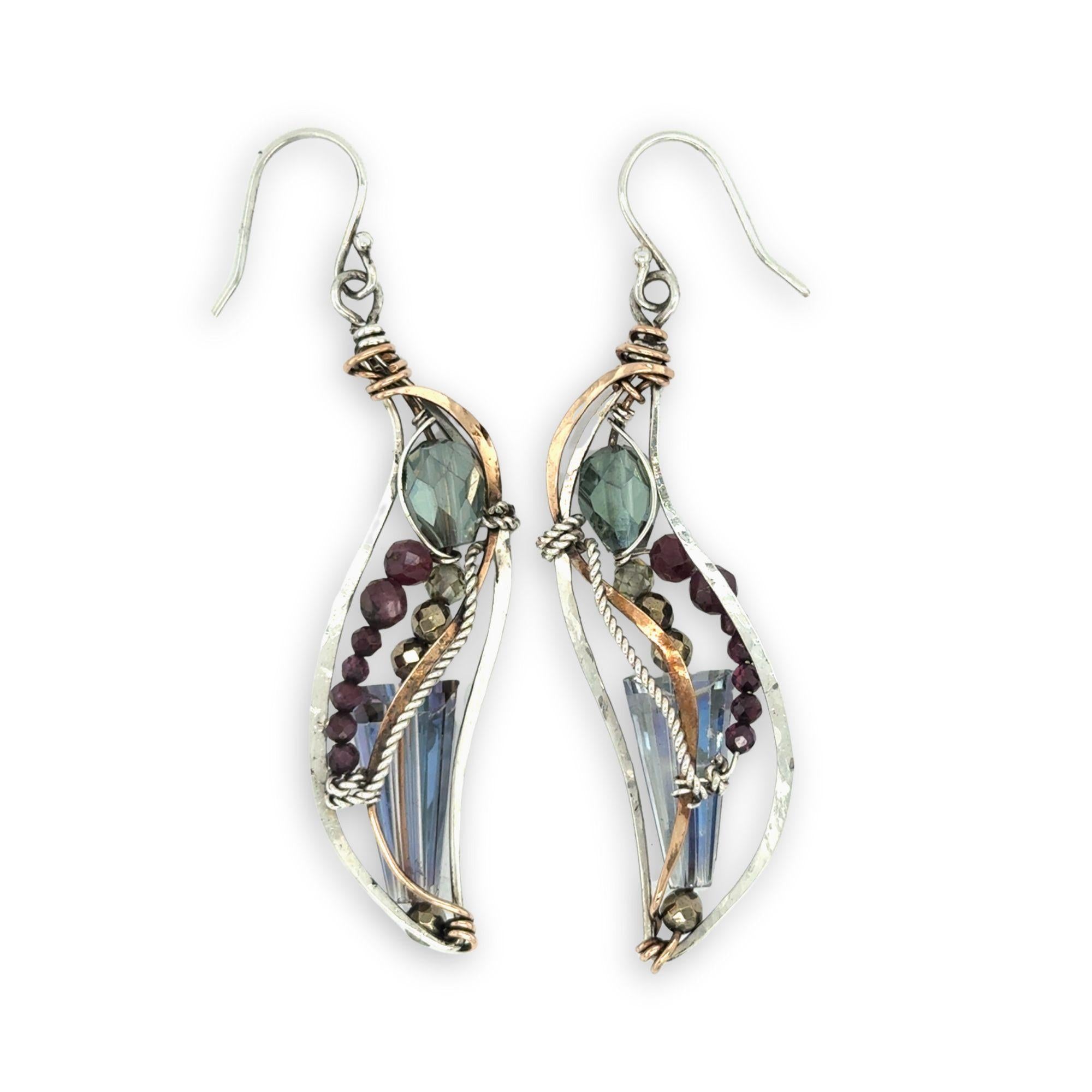Crystal, garnet, and pyrite gemstones decorate sterling silver wing earrings with bronze accents