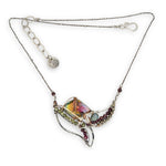 Garnet, green cubic zirconia, pyrite, and colorful crystal gemstones in oxidized stamped sterling silver wing necklace pendant with bronze accents