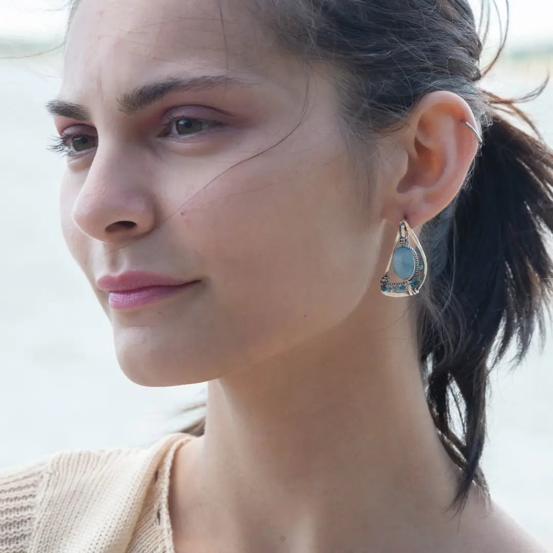 oxidized sterling silver semi circle earrings featuring smooth larimar ovals and apatite gemstones with built in earring hooks that wear like a post earring