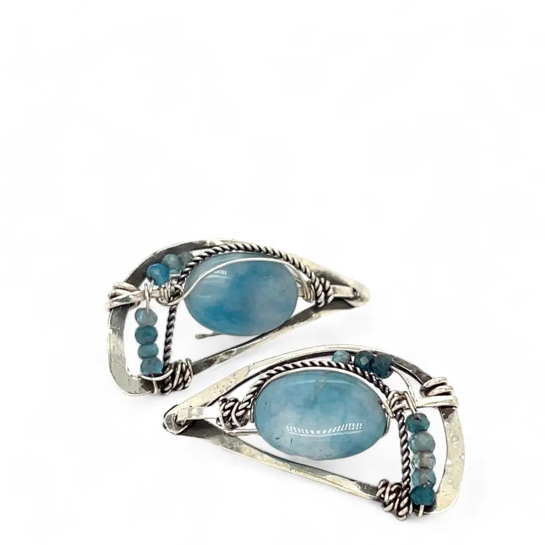 oxidized sterling silver semi circle earrings featuring smooth larimar ovals and apatite gemstones with built in earring hooks that wear like a post earring