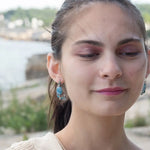 oxidized sterling silver semi circle earrings featuring smooth larimar ovals and apatite gemstones with built in earring hooks that wear like a post earring