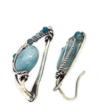 oxidized sterling silver semi circle earrings featuring smooth larimar ovals and apatite gemstones with built in earring hooks that wear like a post earring