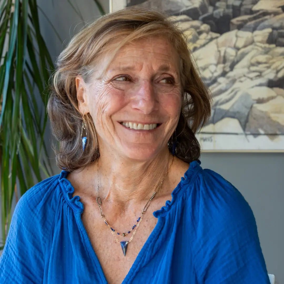 Handmade brass oval links suspended between pyrite gemstones links and lapis gemstones with a lapis point on gold filled oval chain layered necklace