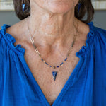 Handmade brass oval links suspended between pyrite gemstones links and lapis gemstones with a lapis point on gold filled oval chain layered necklace