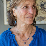 Handmade brass oval links suspended between pyrite gemstones links and lapis gemstones with a lapis point on gold filled oval chain layered necklace