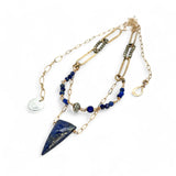 Handmade brass oval links suspended between pyrite gemstones links and lapis gemstones with a lapis point on gold filled oval chain layered necklace