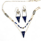 Handmade brass oval links suspended between pyrite gemstones links and lapis gemstones with a lapis point on gold filled oval chain layered necklace