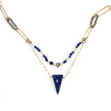 Handmade brass oval links suspended between pyrite gemstones links and lapis gemstones with a lapis point on gold filled oval chain layered necklace