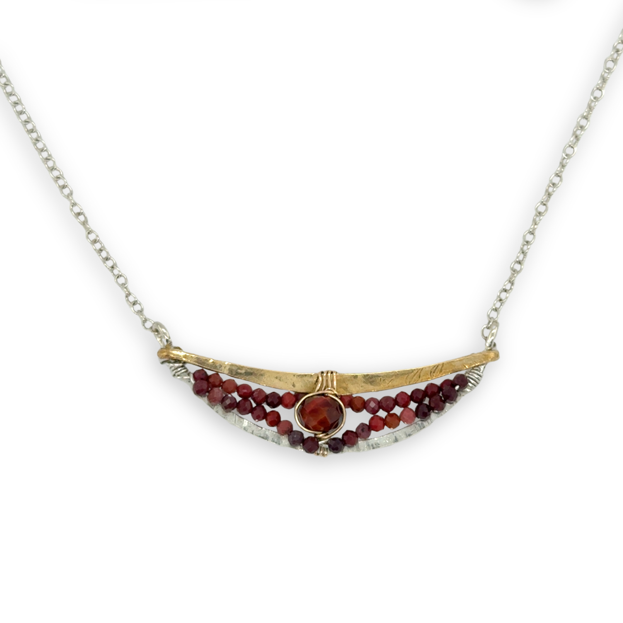 Hammered sterling silver and brass crescent necklace filled with red tiger's eye and mookaite jasper gemstones on a delicate sterling chain