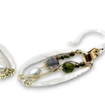 Sterling silver mini oval earrings on a hammered brass strap filled with iolite, silver fresh water pearls, crystal, and black opal gemstones on 14k gold filled wire