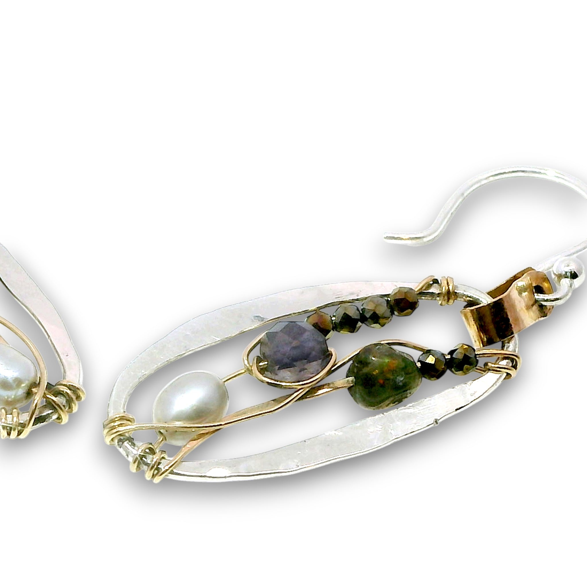Sterling silver mini oval earrings on a hammered brass strap filled with iolite, silver fresh water pearls, crystal, and black opal gemstones on 14k gold filled wire