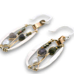 Sterling silver mini oval earrings on a hammered brass strap filled with iolite, silver fresh water pearls, crystal, and black opal gemstones on 14k gold filled wire