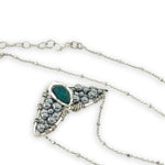 Necklace with sterling silver wings shaped pendant featuring a chrysocolla gemstone and smooth pyrite gemstones 