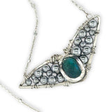 Necklace with sterling silver wings shaped pendant featuring a chrysocolla gemstone and smooth pyrite gemstones 