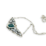 Necklace with sterling silver wings shaped pendant featuring a chrysocolla gemstone and smooth pyrite gemstones 