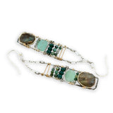 Flashy labradorite, jade, moss agate, and chrysocolla gemstones stacked within and oxidized sterling silver skinny ladder earring frame on gold filled wire