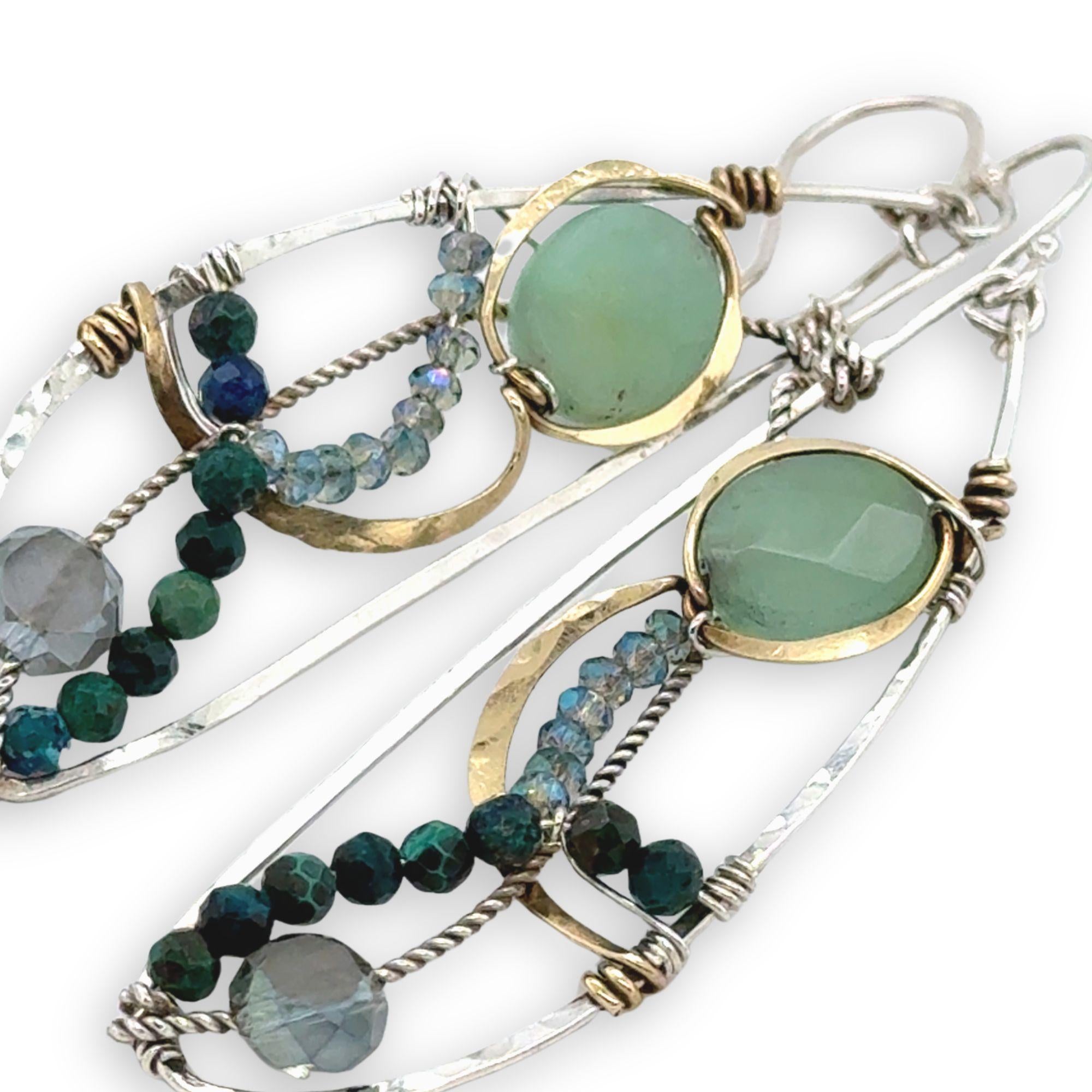 Handmade hammered sterling silver wings embellished with jade, chrysocolla, crystal, brass, and oxidized sterling silver twist wires