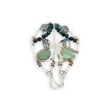 Handmade hammered sterling silver wings embellished with jade, chrysocolla, crystal, brass, and oxidized sterling silver twist wires