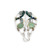 Handmade hammered sterling silver wings embellished with jade, chrysocolla, crystal, brass, and oxidized sterling silver twist wires