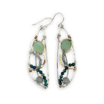 Handmade hammered sterling silver wings embellished with jade, chrysocolla, crystal, brass, and oxidized sterling silver twist wires