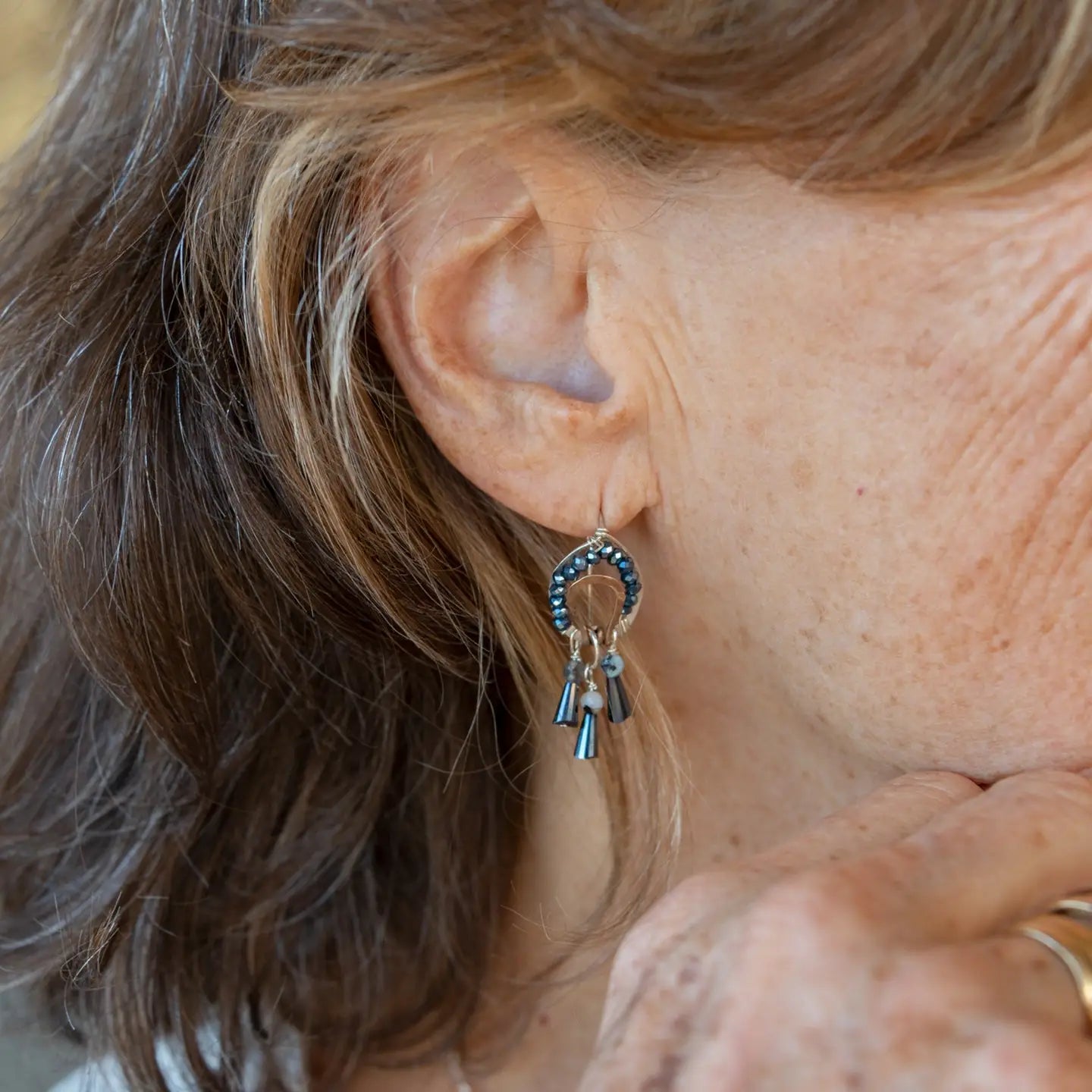 Sterling silver mini earrings with built in earring hooks that wear like a post earrings, with bronze hammered accents, featuring. ink blue crystal and aquamarine gemstones