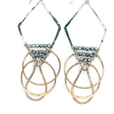 Sterling silver handmade diamond earrings with three bronze rings hanging from the bottom accented with silver pyrite gemstones