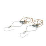 Sterling silver handmade diamond earrings with three bronze rings hanging from the bottom accented with silver pyrite gemstones