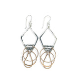 Sterling silver handmade diamond earrings with three bronze rings hanging from the bottom accented with silver pyrite gemstones