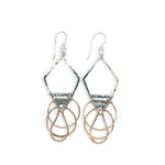 Sterling silver handmade diamond earrings with three bronze rings hanging from the bottom accented with silver pyrite gemstones